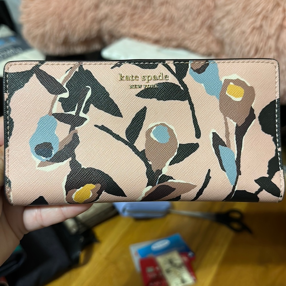 NWOT Kate Spade wallet. Pink w blue, black, yellow, brown flowers. Button snap.